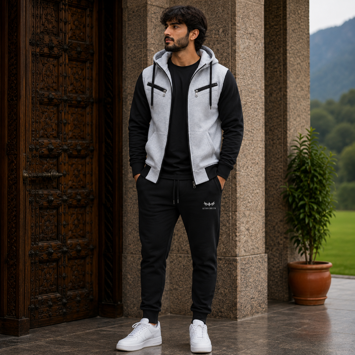 AERODECK APPARELS grey and black zip hoodie and black trouser tracksuit set worn by a model